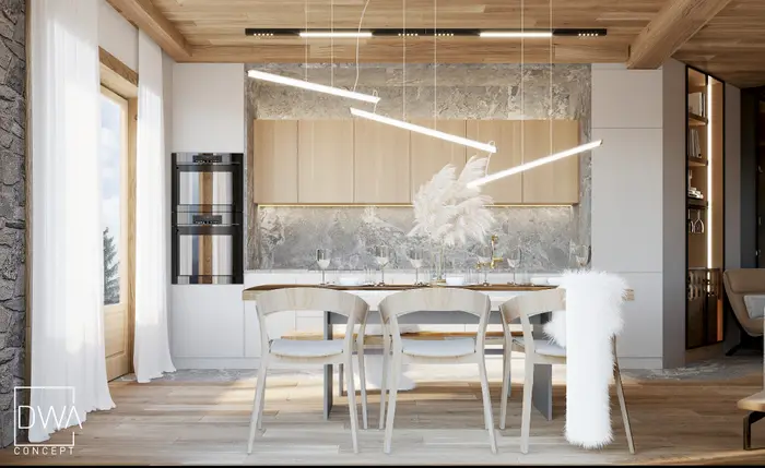Kuchnia z jasną zabudową, kamiennym panelem i jadalnią z krzesłami przy oknie - apartament w Kościelisku